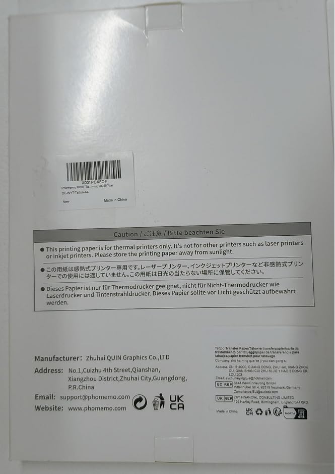 The Phomemo A4 Tattoo Transfer Paper, compatible with the M08F thermal printer, includes multilingual instructions and warns against sun exposure. Manufacturer details and contact information are conveniently printed at the bottom. Comes in a pack of 100 sheets.