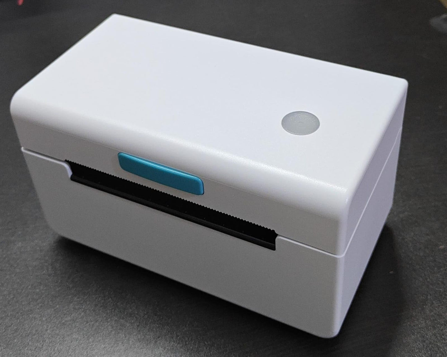 The KUPIS KP410 is a white tabletop thermal label printer featuring a blue front button, set against a dark surface. Its sleek, modern design includes a circular power button on top and offers quality printing with flexible label sizes, perfect for ecommerce barcode use.